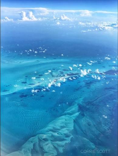 Aerial view of turquoise shoals and sandbars from above